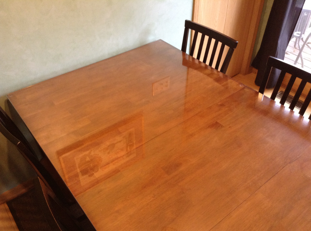 We put a glass top on our wooden kitchen table - Jill Cataldo