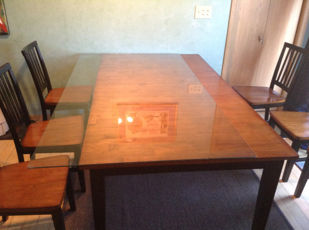 we put a glass top on our wooden kitchen table - jill cataldo