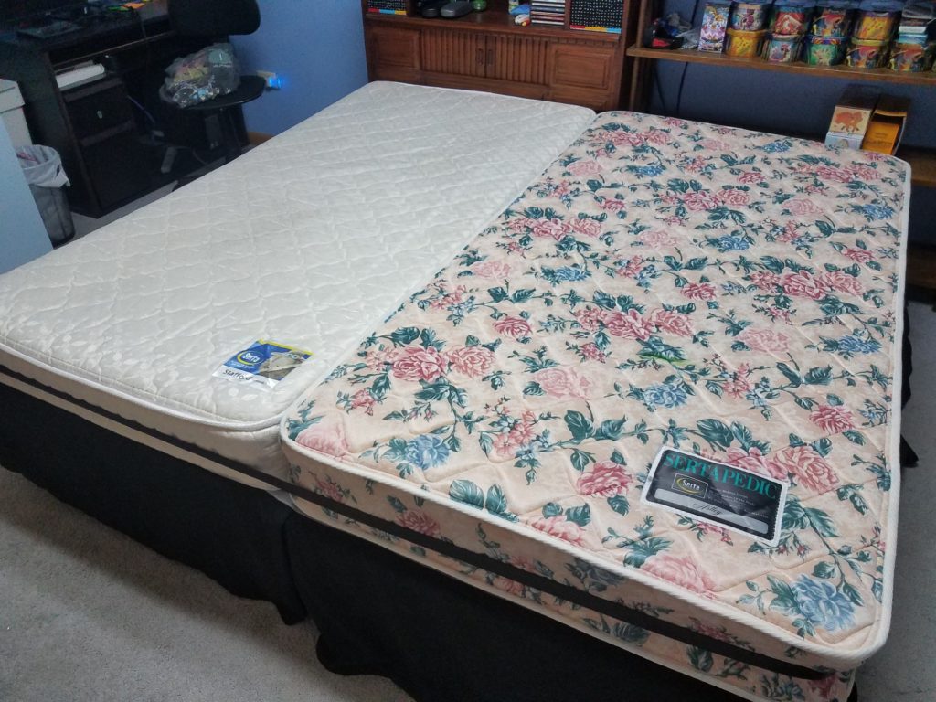 2 twin bed together with mattress topper